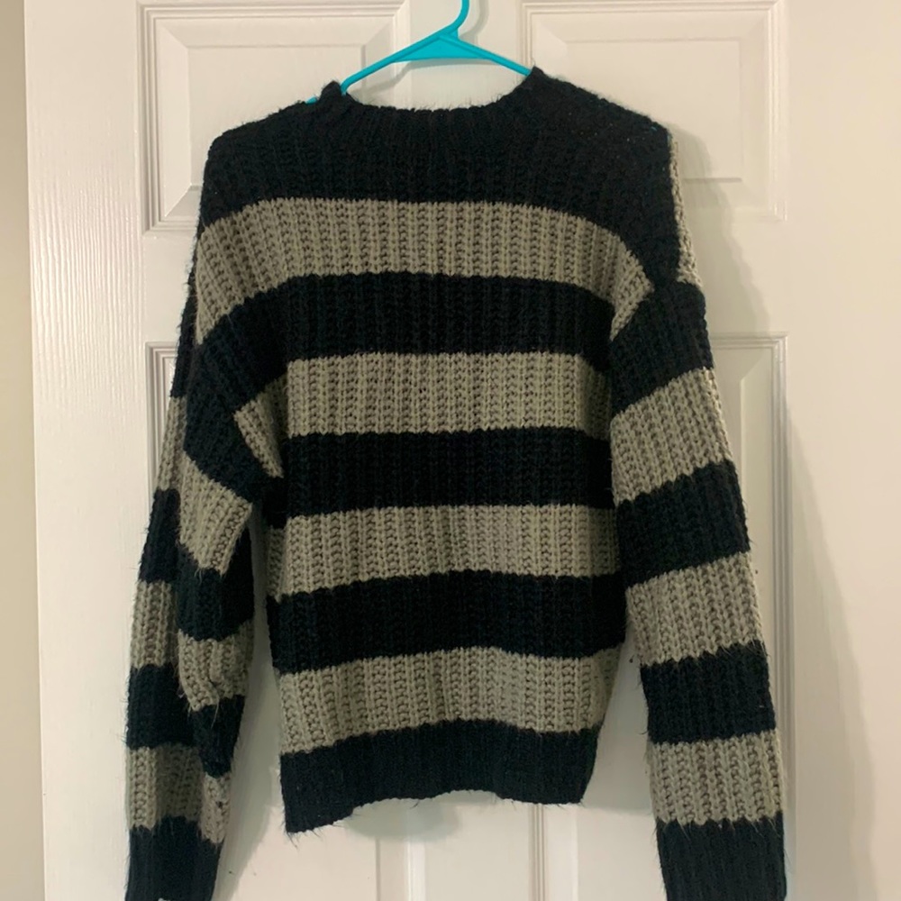 A fleece, black and grey patterned sweater purchased from SHEIN